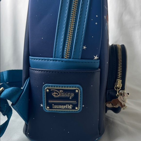Loungefly  Peter Pan Backpack with glow in the dark clock.‎